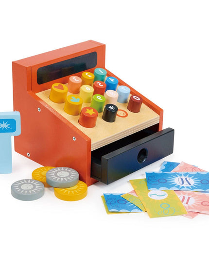 Toy cash register with colorful buttons and coins on a white background