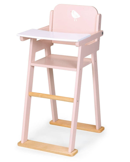 Pink and wooden high chair on a white background