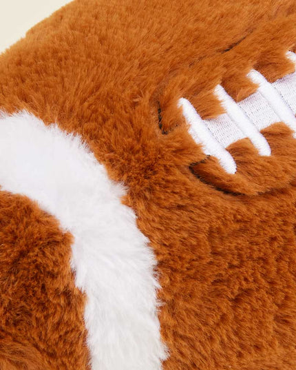 Plush football toy with brown and white colors on a white background
