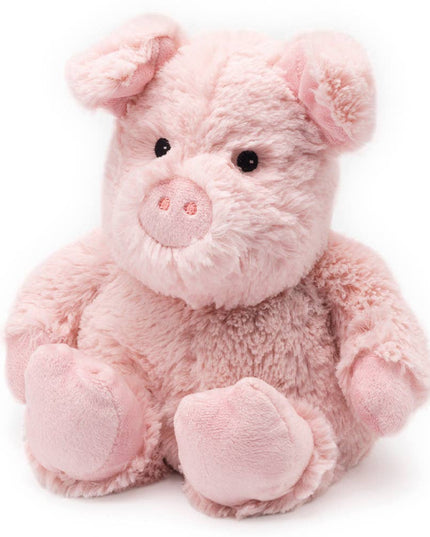 Pink plush pig toy on a white background