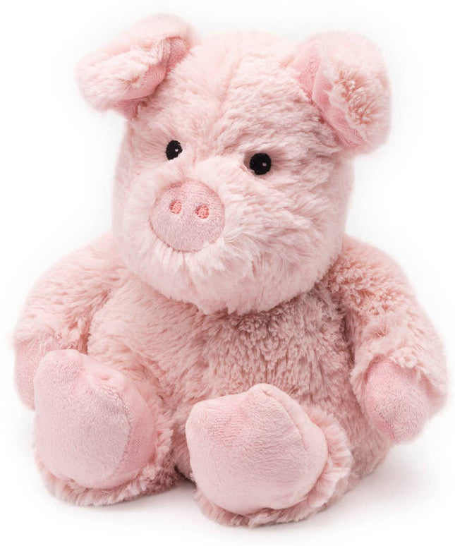 Pink plush pig toy on a white background