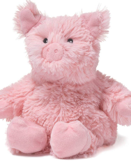 Pink plush pig toy on a white background