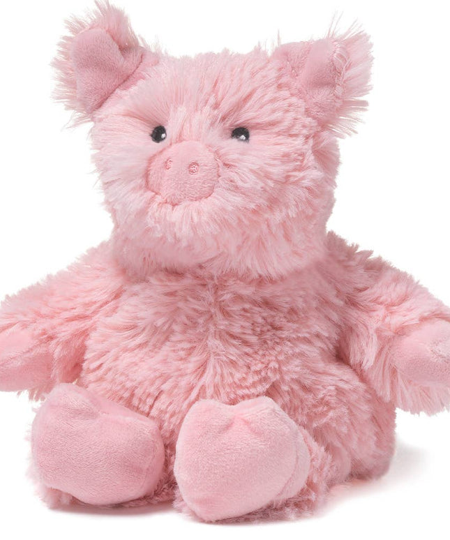 Pink plush pig toy on a white background