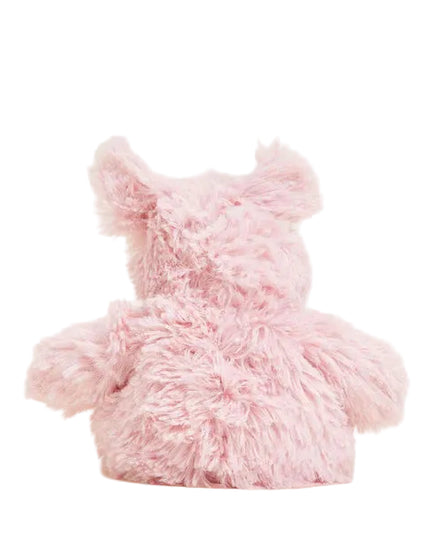 Pink plush pig toy on a white background