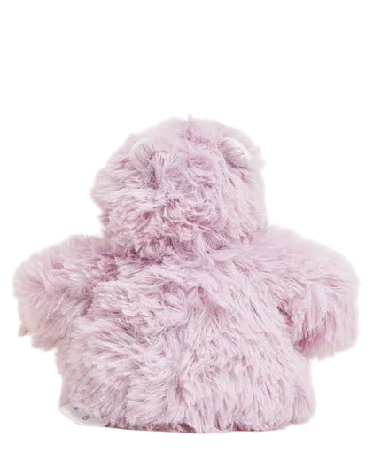 Pink fluffy teddy bear on a white background