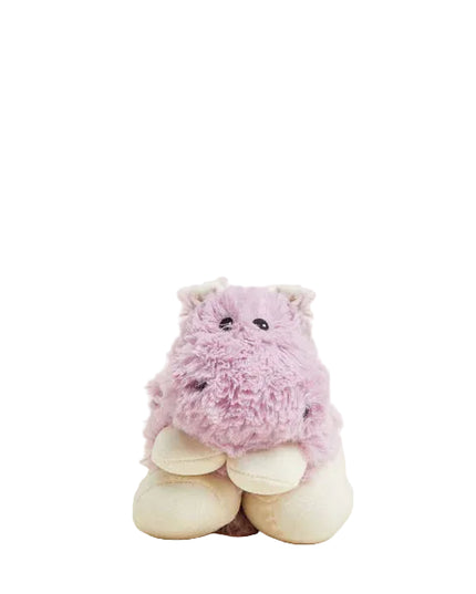 Pink plush toy with white feet on a beige background