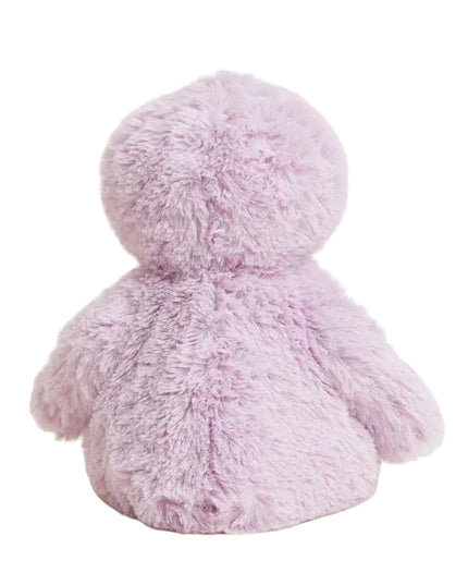 Fluffy pink toy on a light beige background
