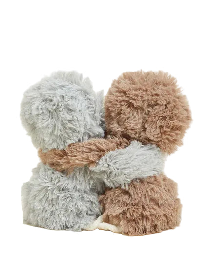 Two fluffy, knitted scarves in gray and brown on a light background