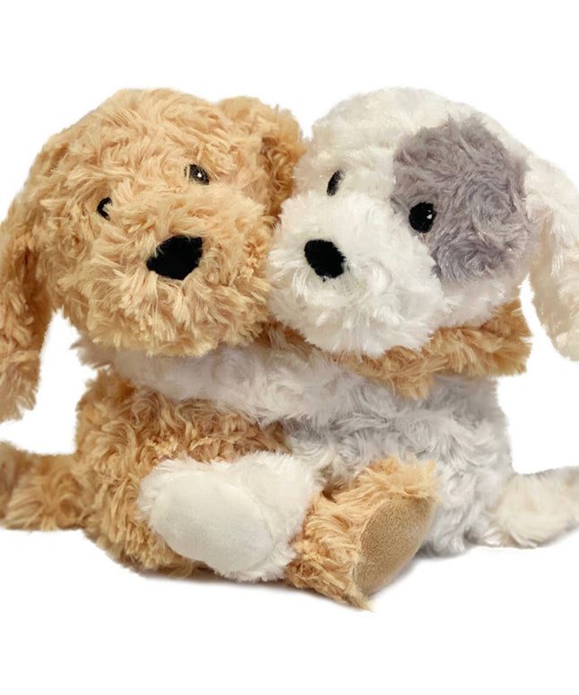 Two plush dogs, one brown and one white with gray patches, on a white background.