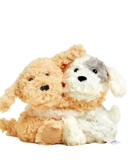 Two plush dogs, one brown and one white with gray patches, on a white background.