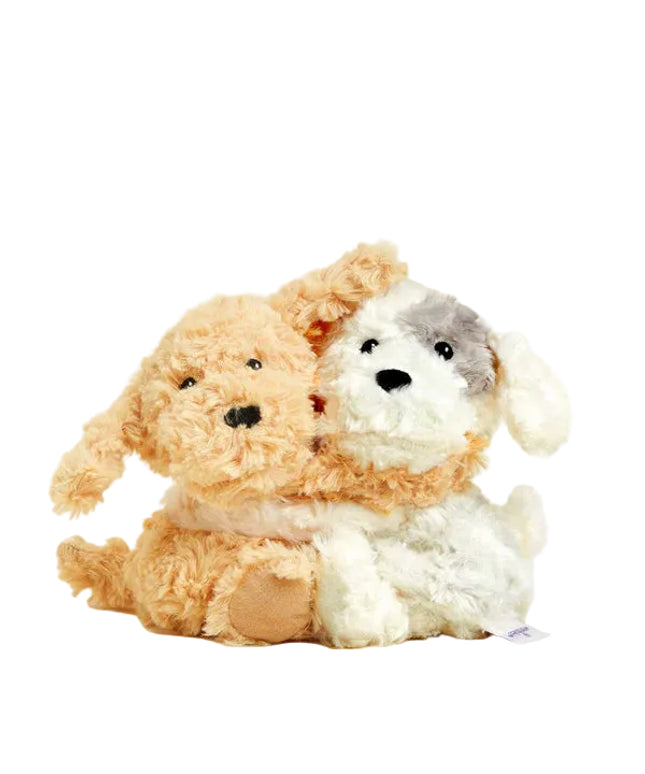 Two plush dogs, one brown and one white with gray patches, on a white background.