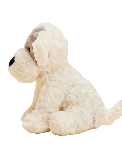 Side view of a beige and tan plush dog Warmies.