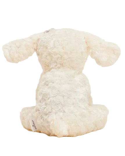 Plush dog Warmies with a brown patch on his white fur.