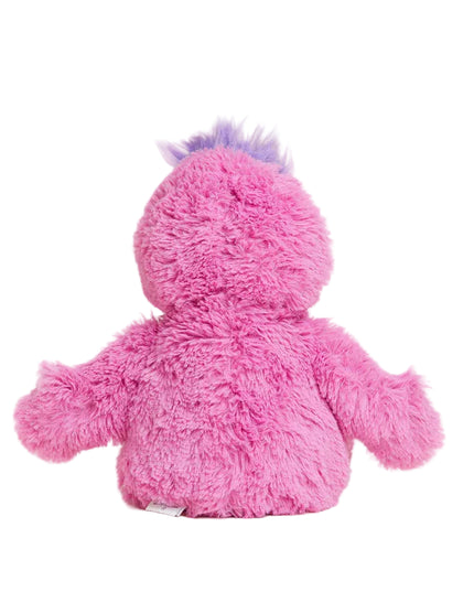 Pink plush toy with purple hair on a light gray background