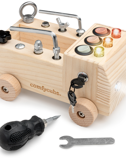 Wooden toy truck with tools on a white background