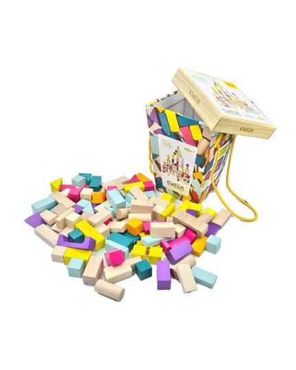 Colorful wooden building blocks spilling out of a wooden box on a white background