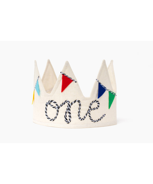 White children's crown with colorful flags spelling 'one' on a white background