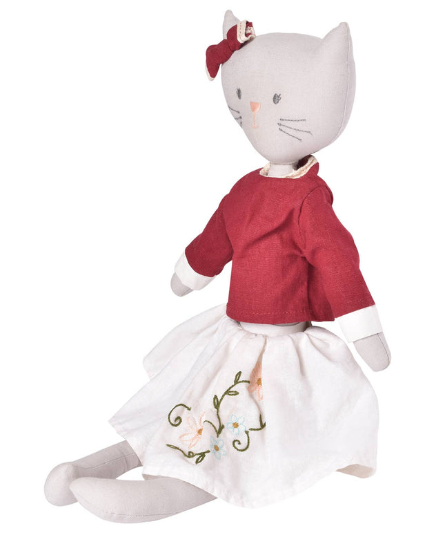 Cat-shaped doll wearing a red sweater and white skirt with floral embroidery on a white background